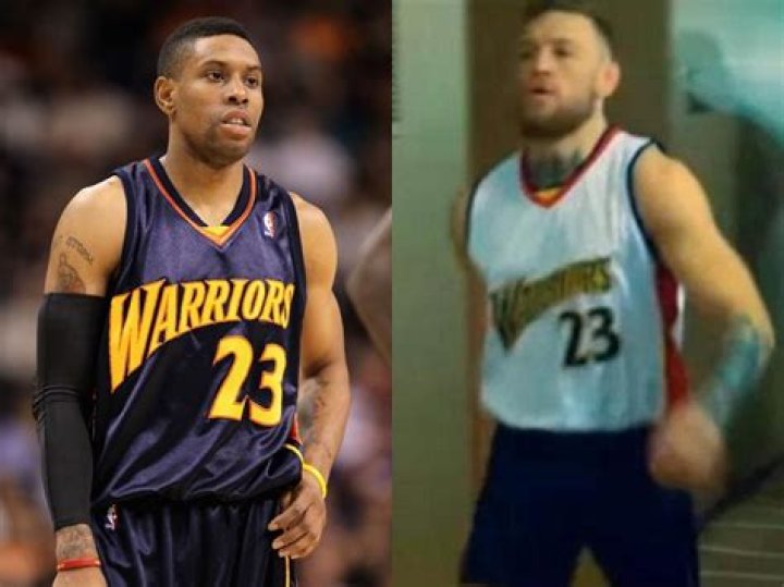 Conor McGregor taunts Floyd Mayweather over domestic abuse conviction by wearing CJ Watson Golden State Warriors jersey