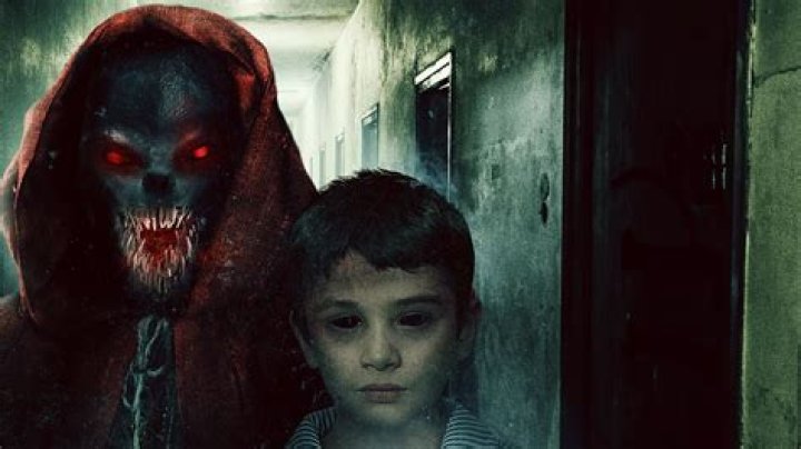 Man 'haunted' by Dear David ghost snaps this terrifying pic of demonic kid staring at him in his bedroom
