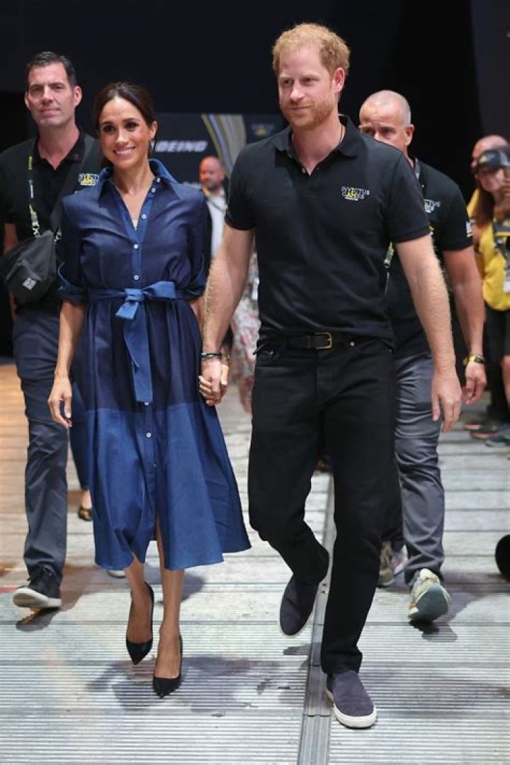 Meghan Markle's £300 Self-Portrait dress sells out within hours, as she steps out with Prince Harry at Invictus Games reception