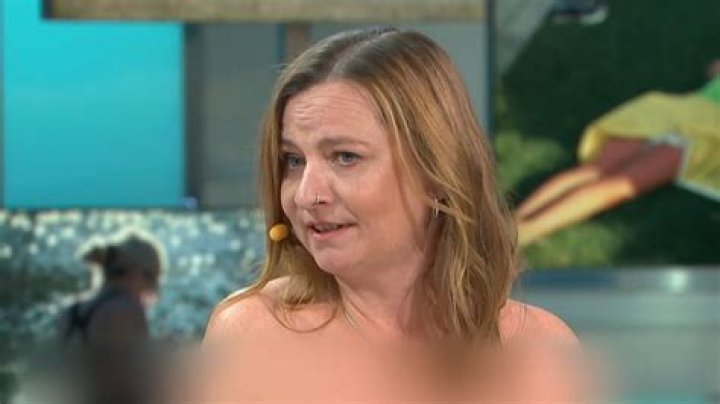 Naked News presenters strip completely NUDE as they take part in dangerous axe-throwing competition