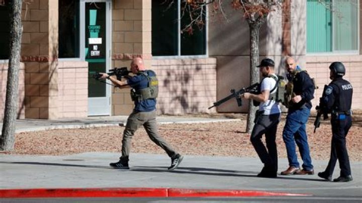 Police: Suspect with gun threatened to kill woman holding baby