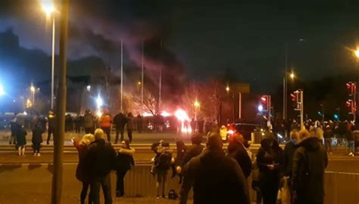 Police van TORCHED as protest over migrants being housed in hotels spirals out of control in Liverpool