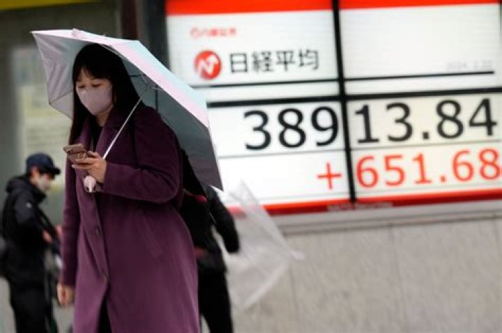 Stock market today: Japan’s benchmark briefly reaches all-time high after rally on Wall Street