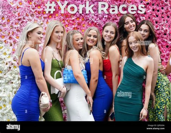 Stunning punters brave damp weather and wear glam frocks to York's Ebor Festival as racegoers enjoy day out